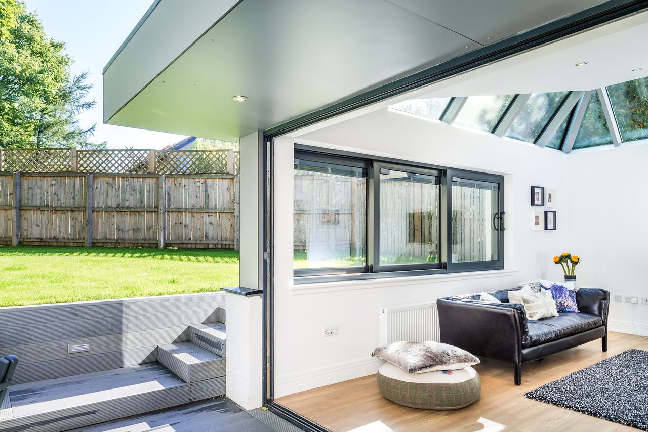 new extension with bifold doors to connect inside and outdoor patio