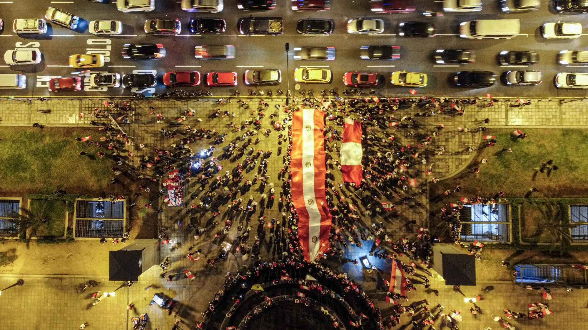 Supporters of Peruvian presidential candidate Rafael Lopez Aliaga protest the official election results outside the Palace of Justice in Lima, Peru
