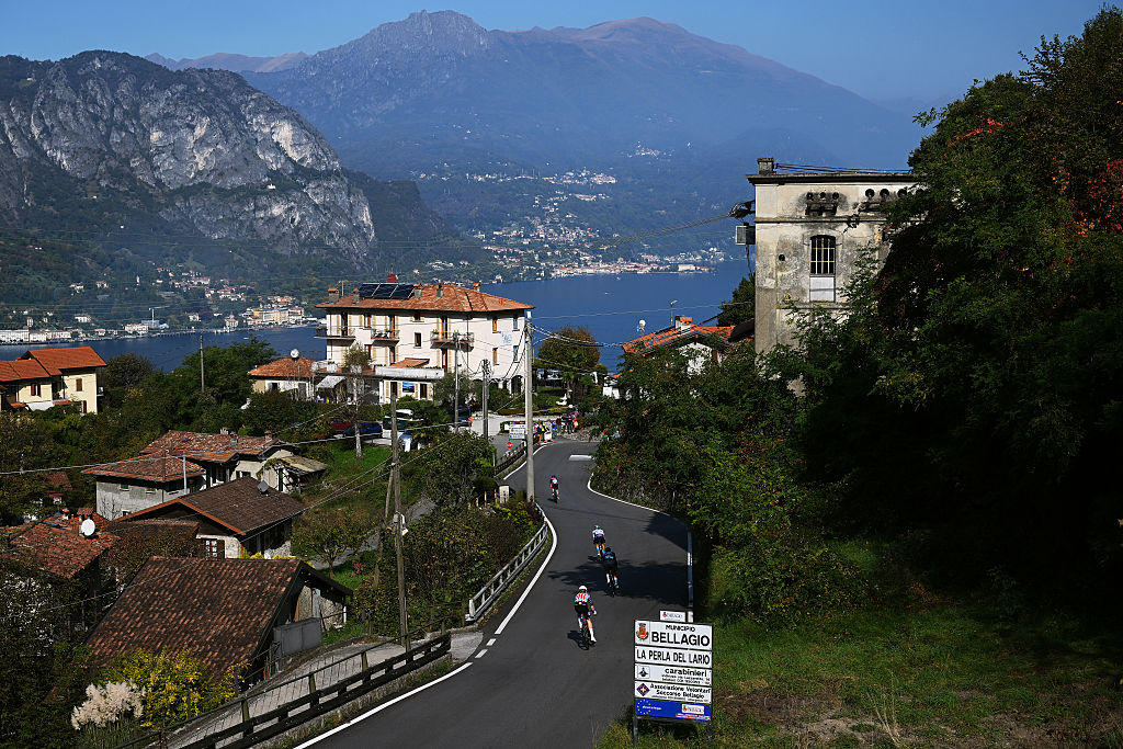 BERGAMO, ITALY - OCTOBER 11: A general view of Pello Bilbao of Spain and Team Bahrain - Victorious, Quinn Simmons of United States and Team Lidl - Trek, Michael Matthews of Australia and Team Team Jayco AlUla, Bjorn Koerdt of Great Britain and Team Picnic PostNL, compete in the breakaway passing through a Bellagio village during the 119th Il Lombardia 2025 a 241km one day race from Como to Bergamo on October 11, 2025 in Bergamo, Italy. (Photo by Dario Belingheri/Getty Images)