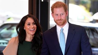 Prince Harry and Meghan Markle pose for the cameras.