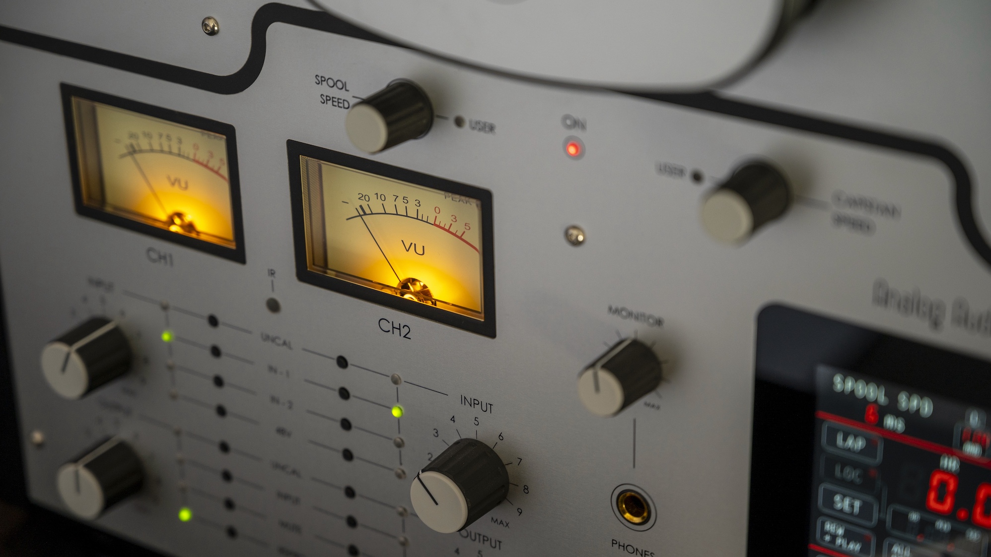 A close-up of the VU meters on an Analog Audio Design reel-to-reel tape machine.