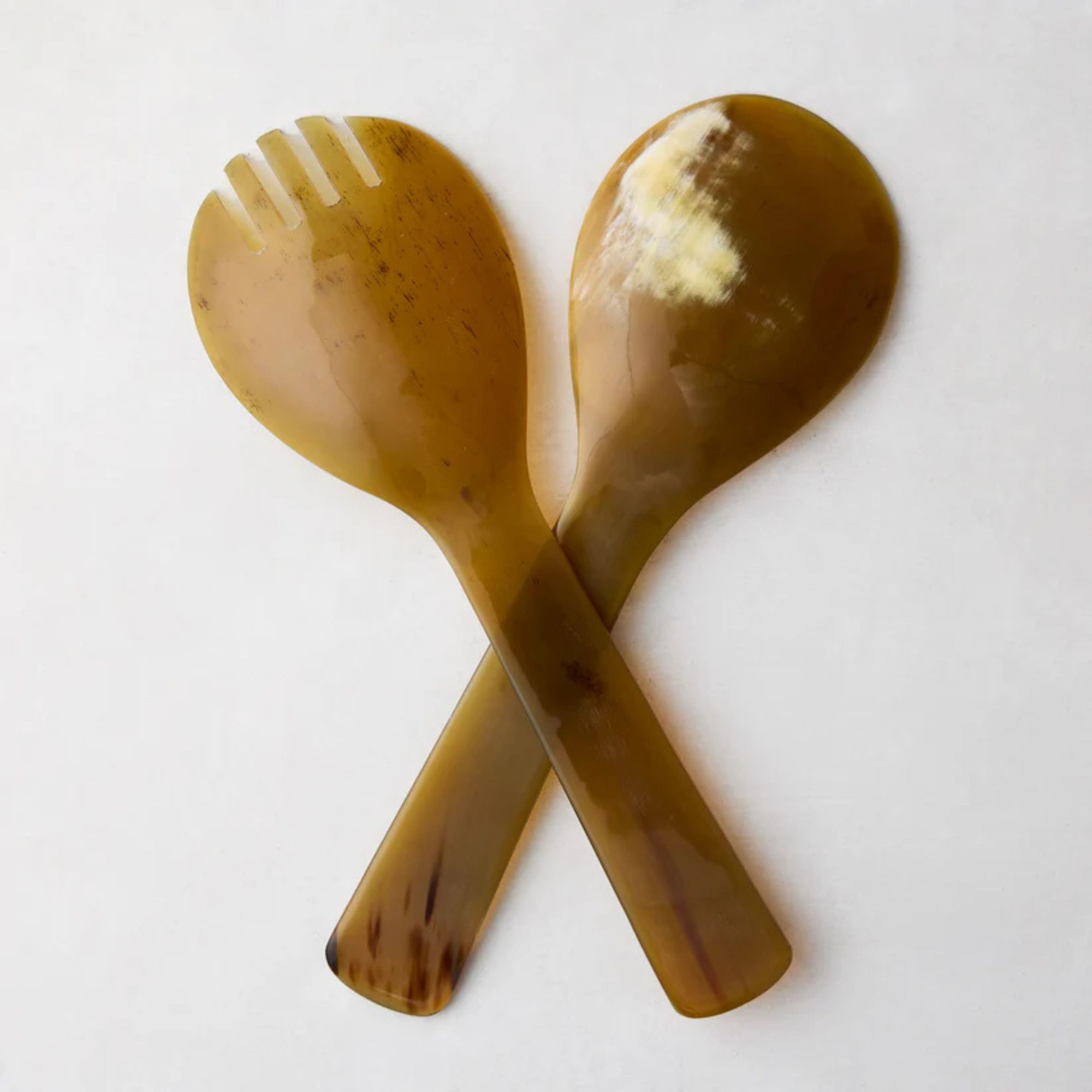 Yellow-green salad servers made from buffalo horn