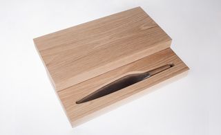 housed in a solid oak cutting board