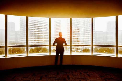 A person looking through glass