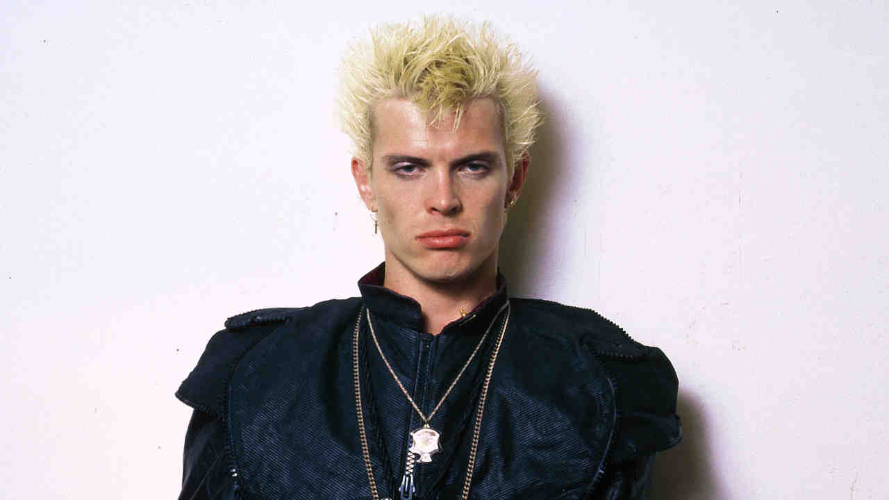 Billy Idol posing for a photograph in the 1980s