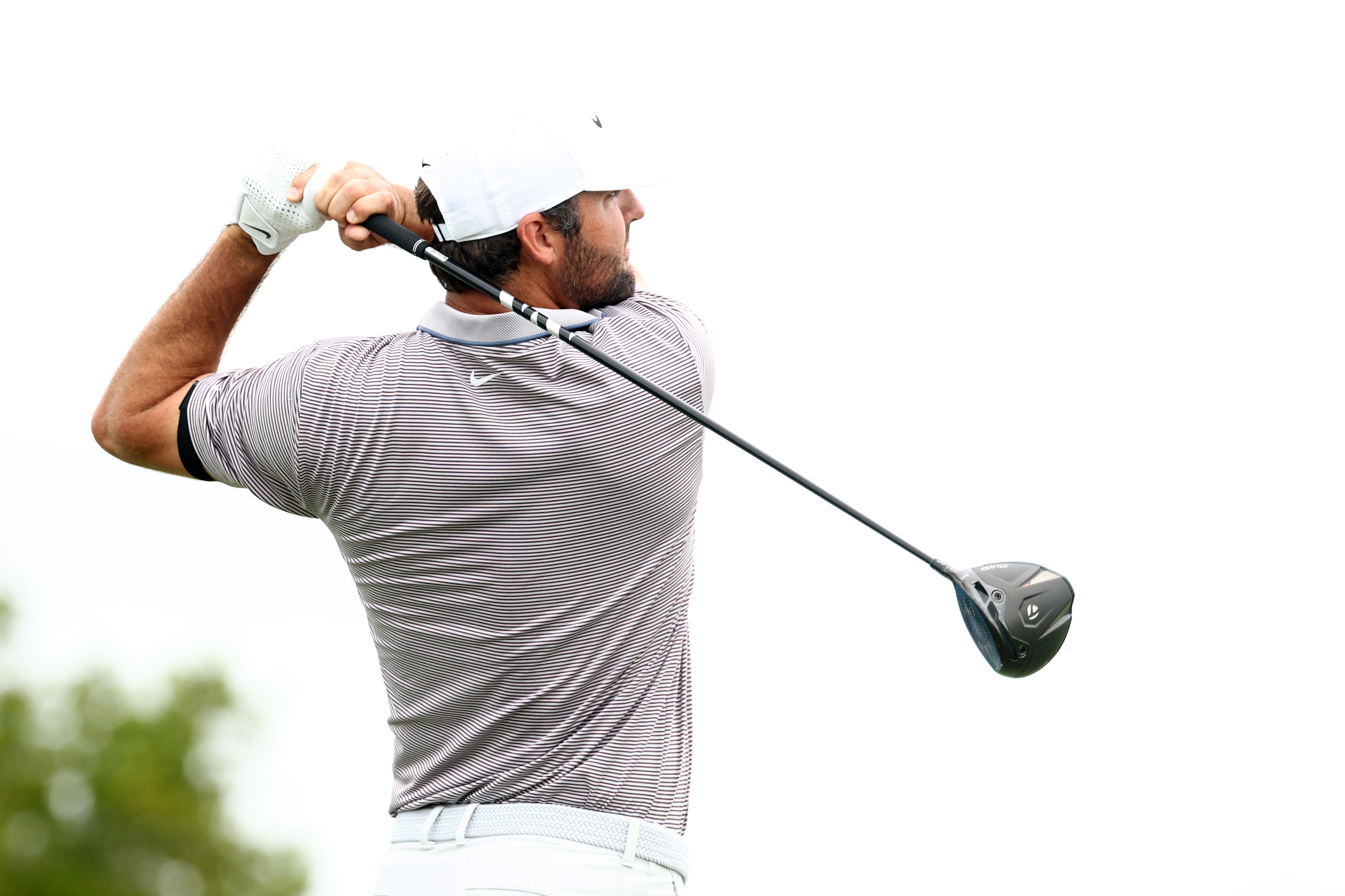 Scottie Scheffler holds his finish on a drive