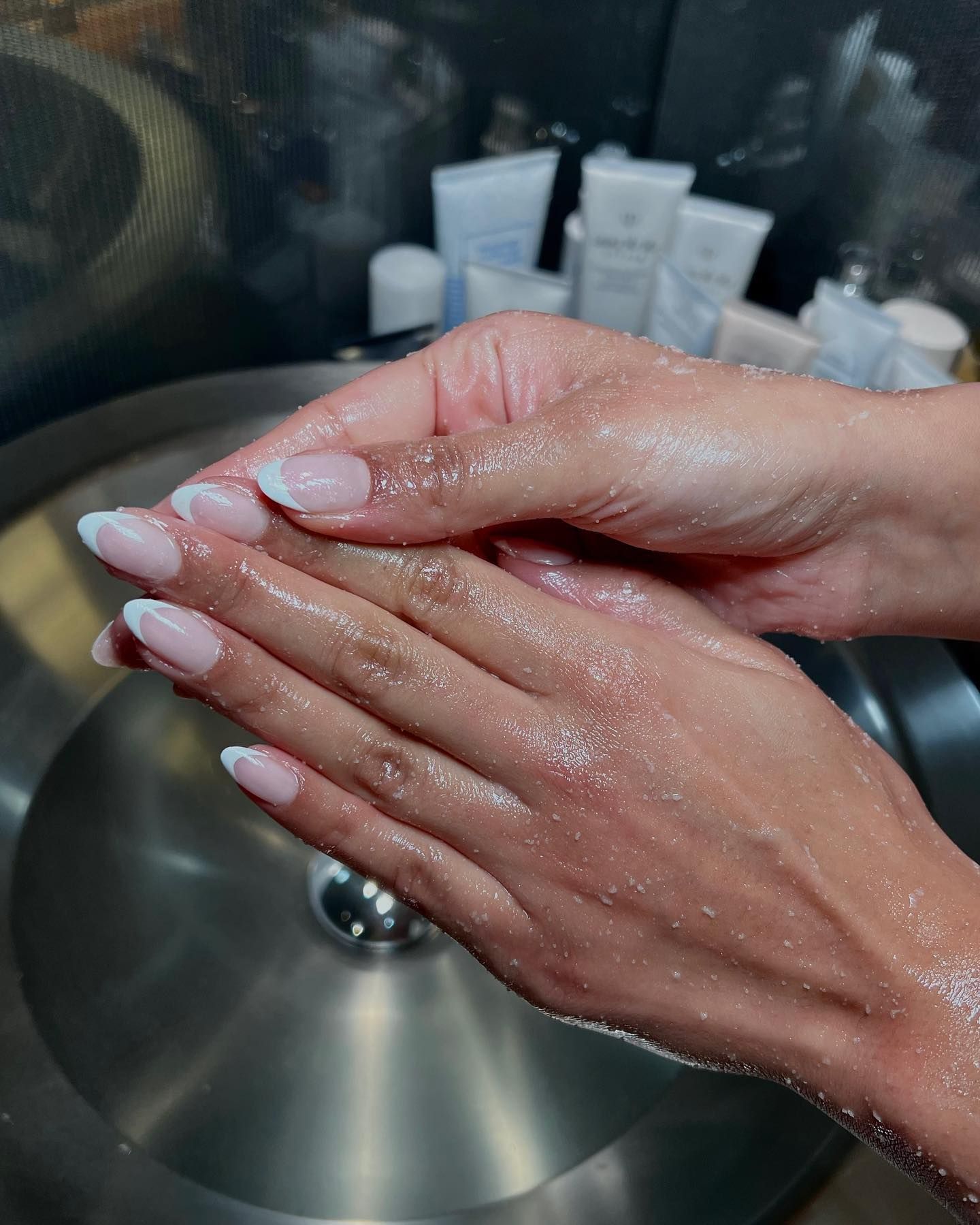 Iram Shelton wearing classic French tip manicure trend