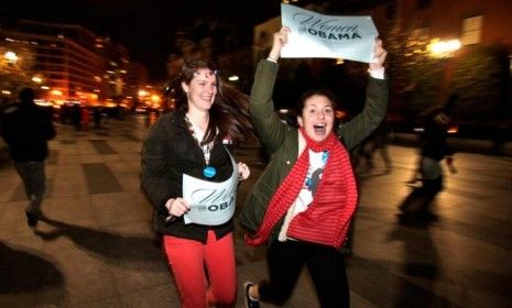 Revelers holding signs that say &amp;quot;Women for Obama&amp;quot;