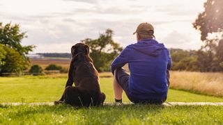 Man and dog taking in the view