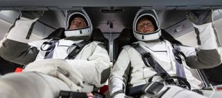 NASA astronauts Doug Hurley and Bob Behnken familiarize themselves with SpaceX’s Crew Dragon, the spacecraft that will transport them to the International Space Station on the Demo-2 test flight in May 2020.