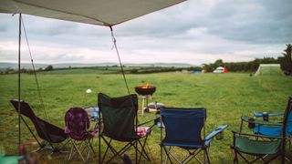 Camping chairs under shelter looking out across the view