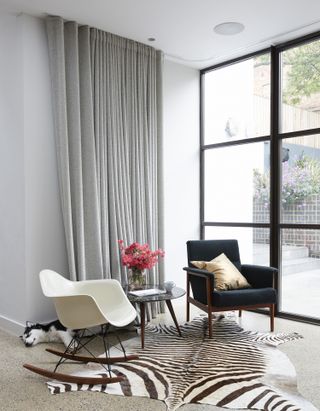 living room with curtains along the wall for texture