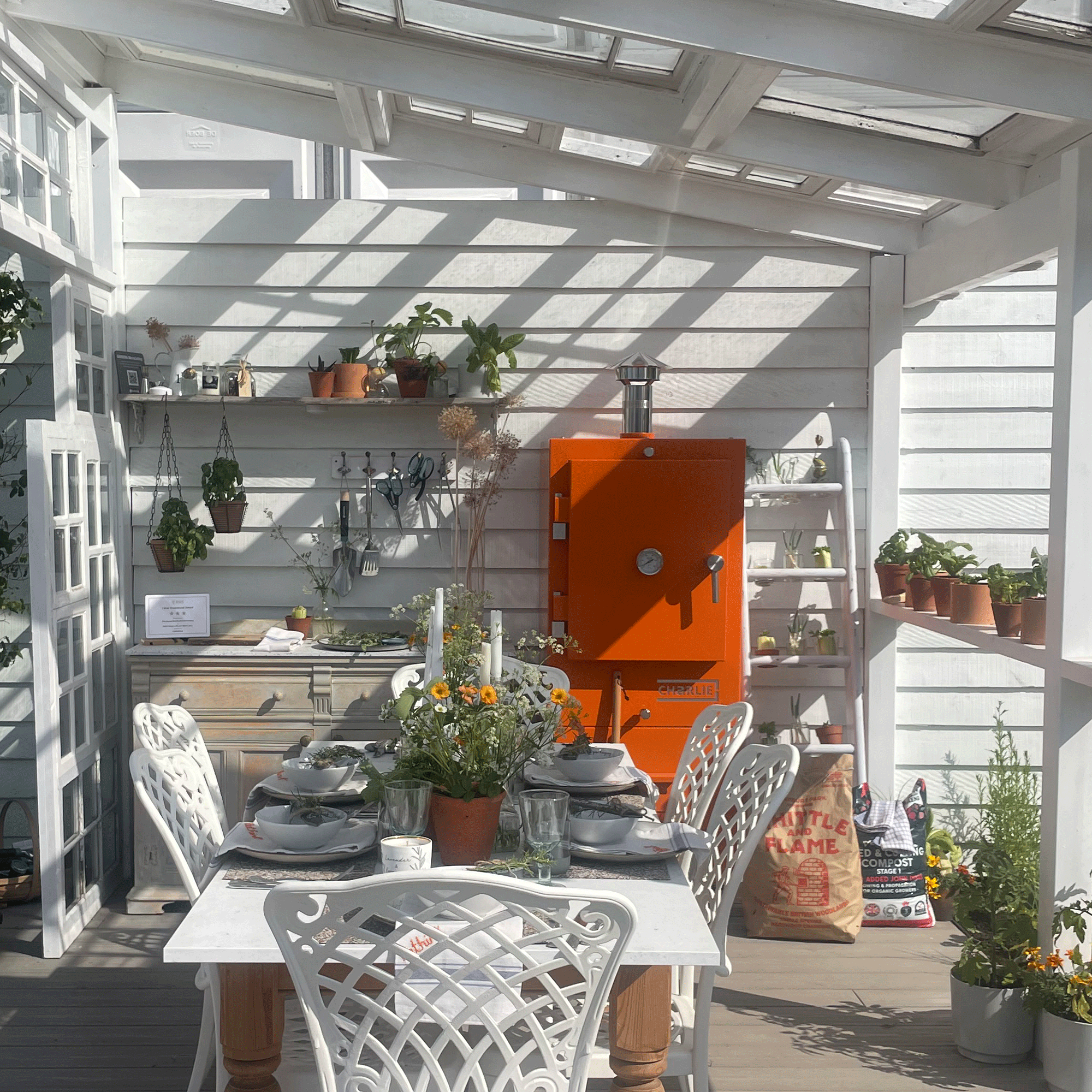 Terracotta sideboard in white show garden