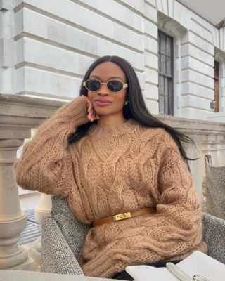 Influencer wears a camel jumper