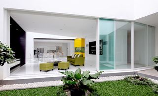 Sliding glass doors create fluid movement between indoor and outdoor spaces