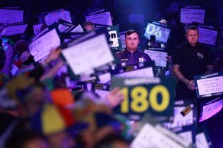 Luke Littler of England enters the arena to face Matt Campbell of Canada during Day Ten of the 2023/24 Paddy Power World Darts Championship at Alexandra Palace on December 27, 2023 in London, England