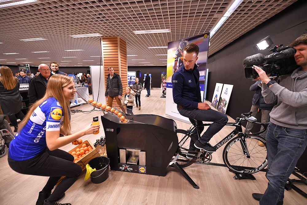 Iljo Keisse puts his legs to work on the orange-juice-squeezing machine