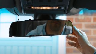 A Nextbase mirror dash cam inside a car