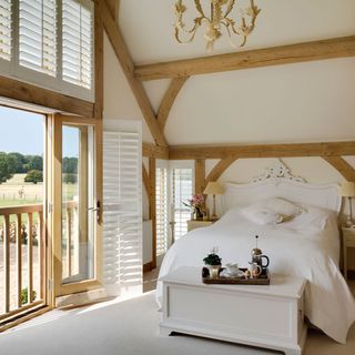 bedroom with french window and white walls