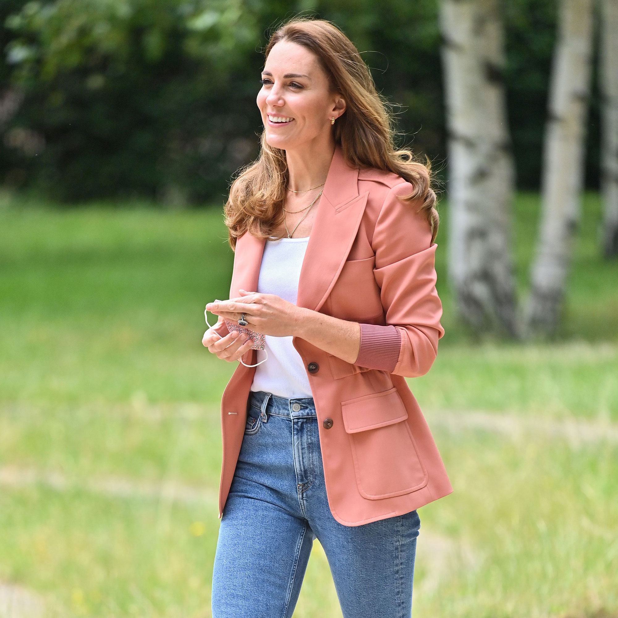 Kate Middleton wears a pink blazer and Veja sneakers