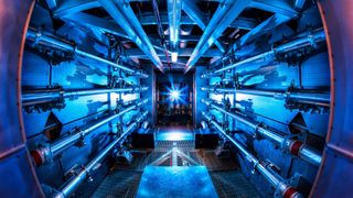 The fusion reactions at the National Ignition Facility takes place at the heart of the world's most powerful laser system, which consumes about 400 MJ of energy each time it's fired.