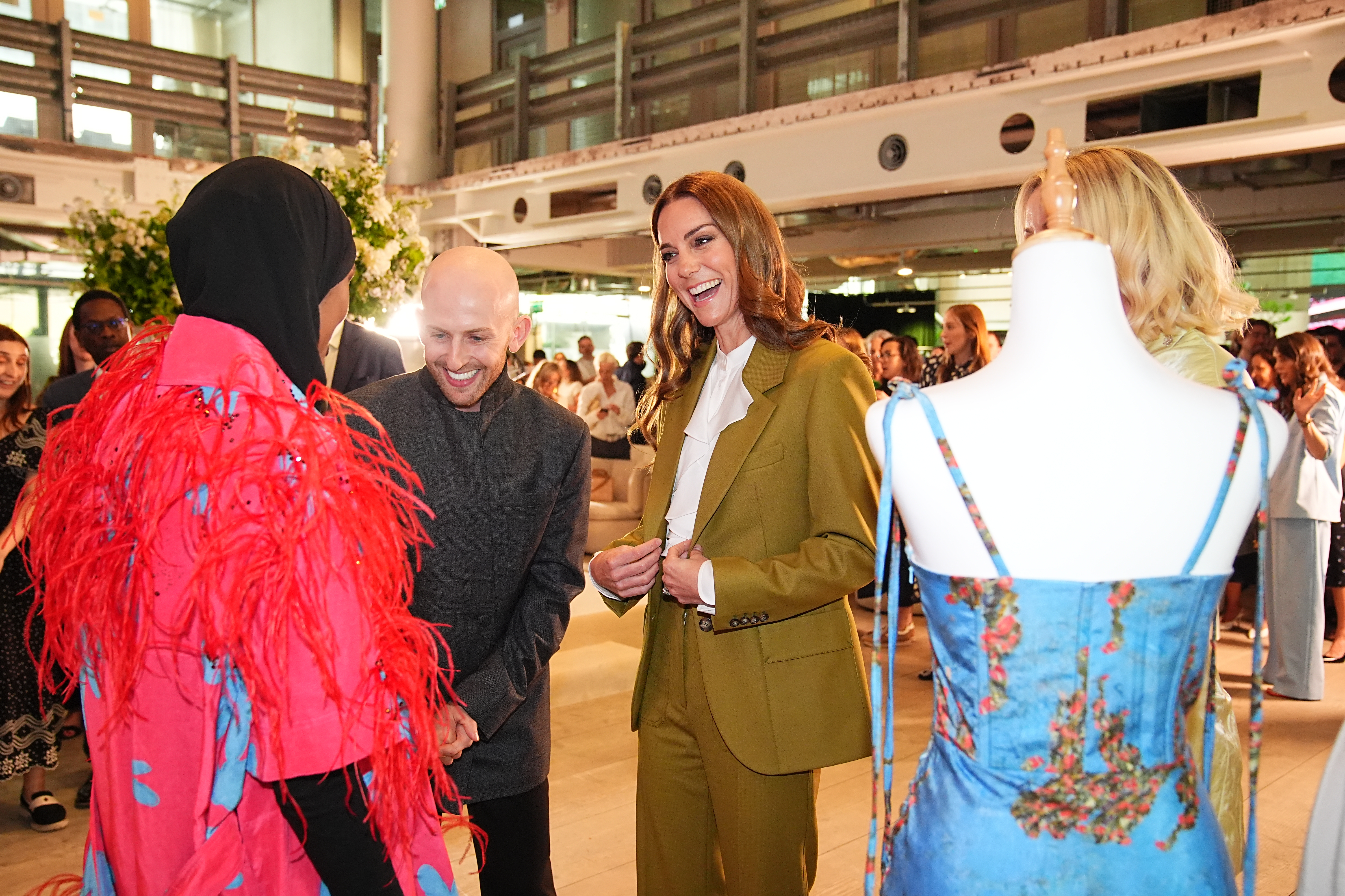 Catherine, Princess of Wales smiles and chats during a visit to the British Fashion Council to present the Queen Elizabeth II Award for British Design