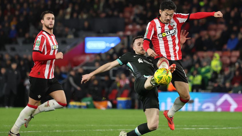 Yuki Sugawara of Southampton tackles Diogo Jota of Liverpool