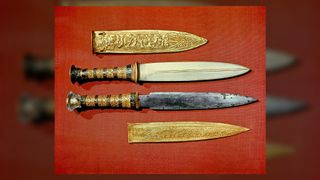 King Tut's two daggers, one with a blade of gold, the other of iron, that were found in his tomb.