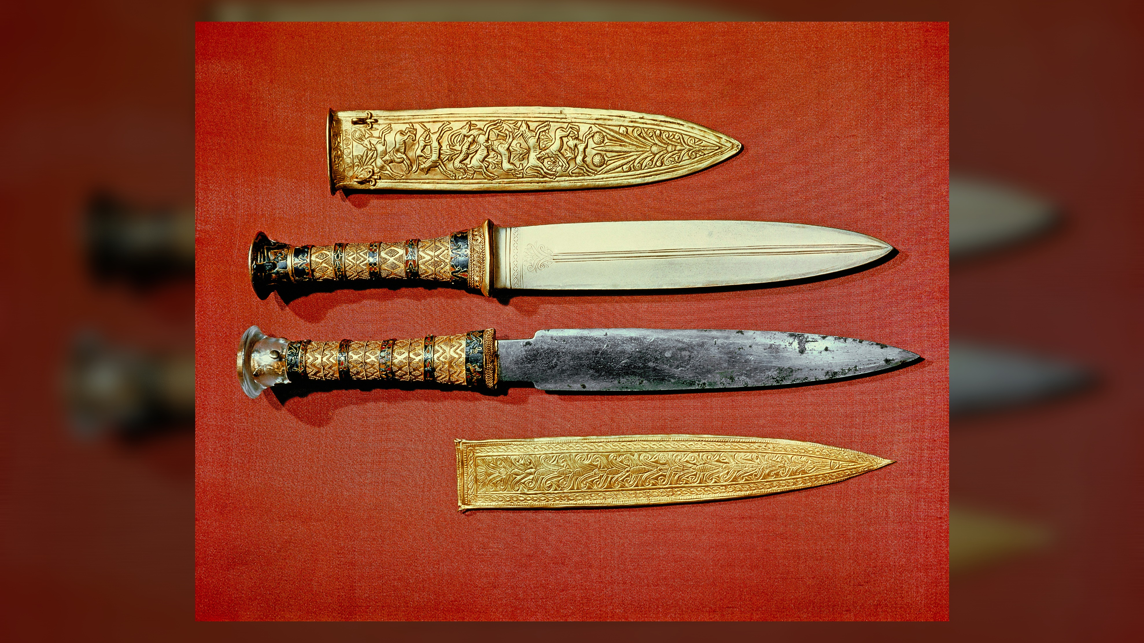 King Tutankhamun's two daggers, one with a gold blade, the other with an iron blade, which were found in his tomb.