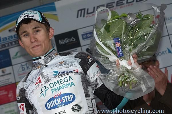 Michal Kwiatkowski (Omega Pharma-Quickstep) steps onto the podium for his first professional win