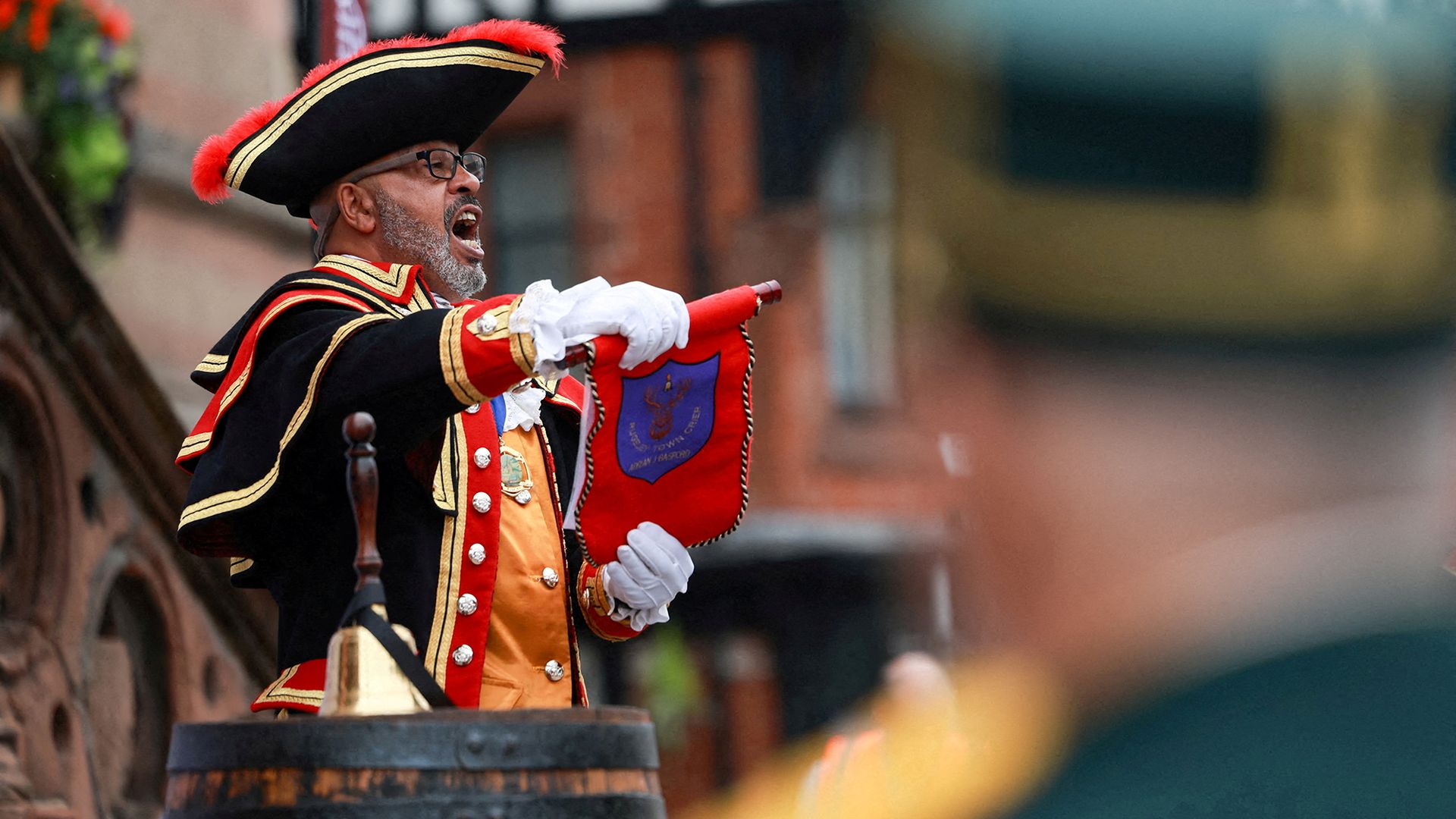 
                                Adrian Basford takes part in the World Town Crier Tournament, which celebrates the tradition of making public announcements on behalf of civic authorities, in Chester, England
                            