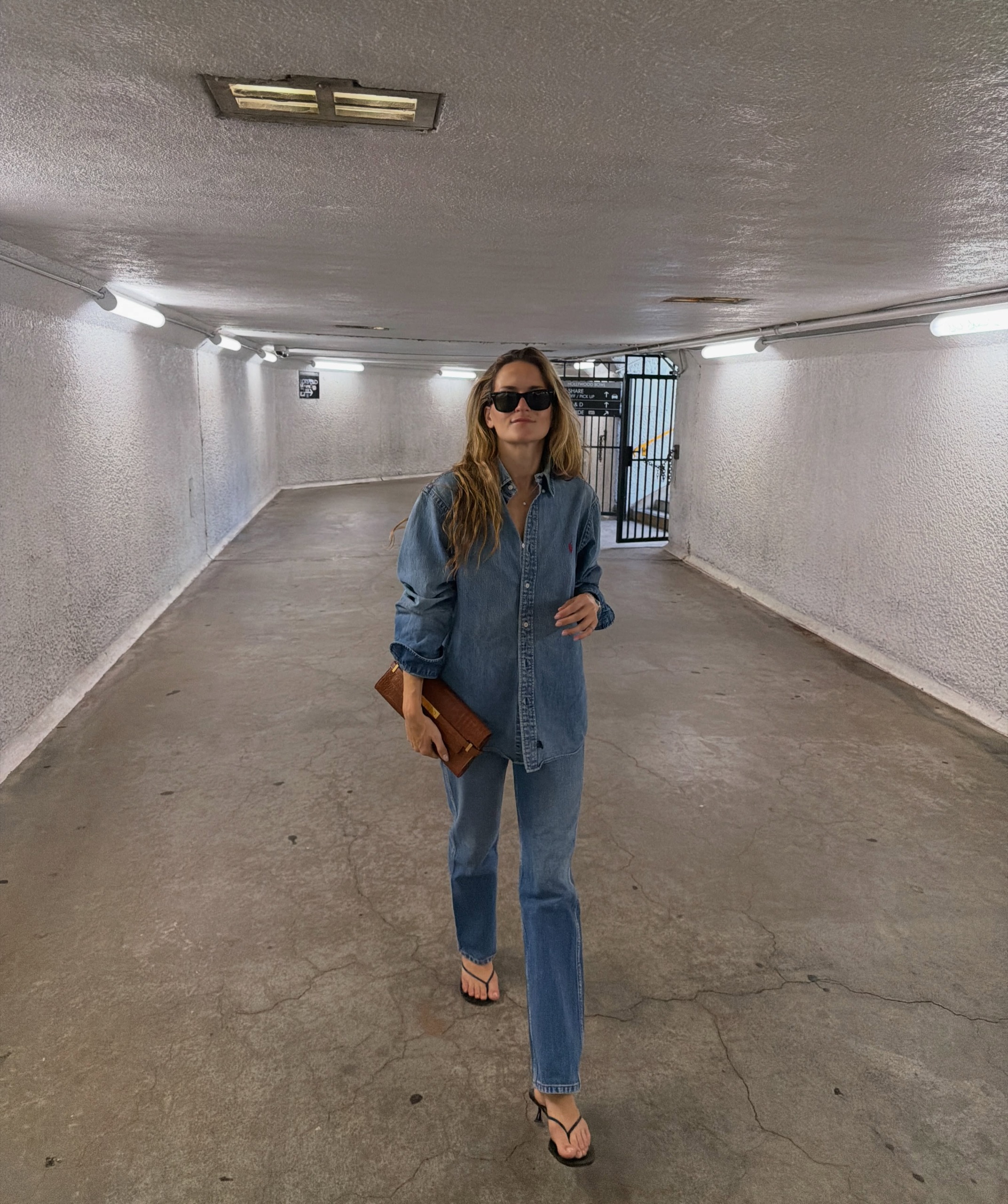 An image of a woman wearing denim shirt outfit 2026