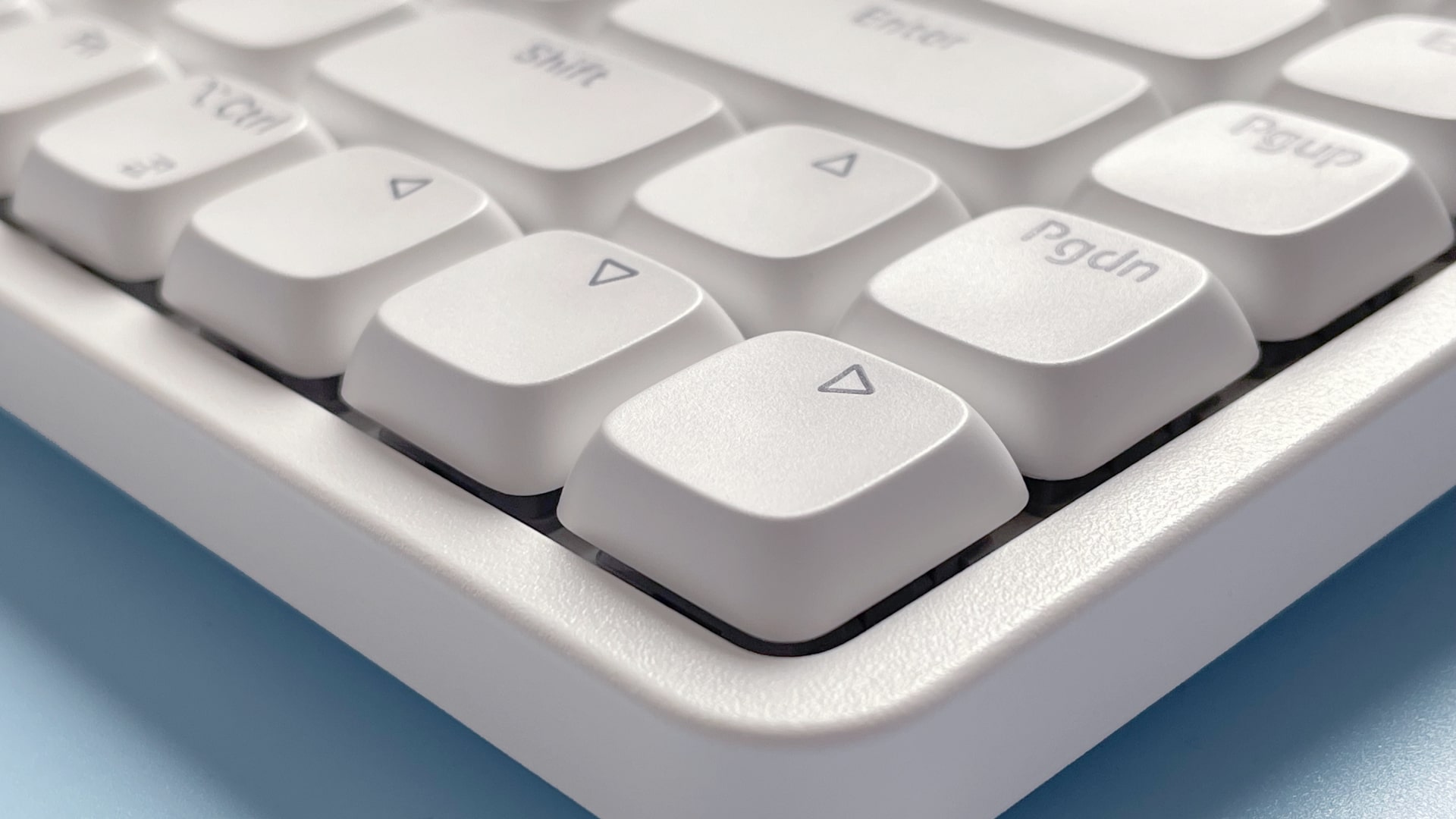 The Lofree Flow Lite mechanical keyboard against a blue background.