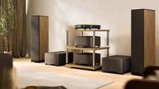 The MSB Technology Sentinel DAC in a bright room between two large floorstanding speakers