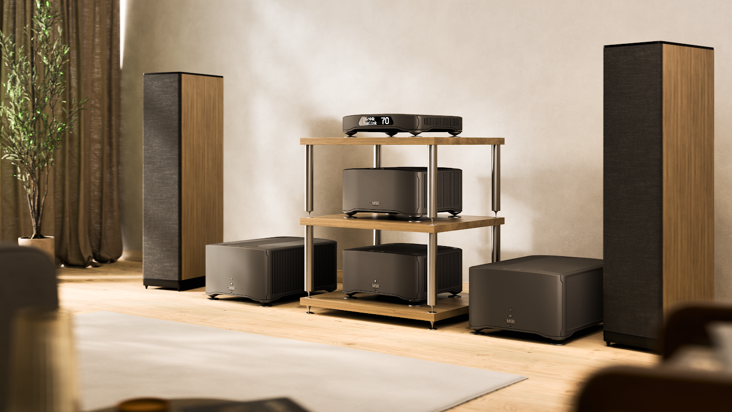 The MSB Technology Sentinel DAC in a bright room between two large floorstanding speakers