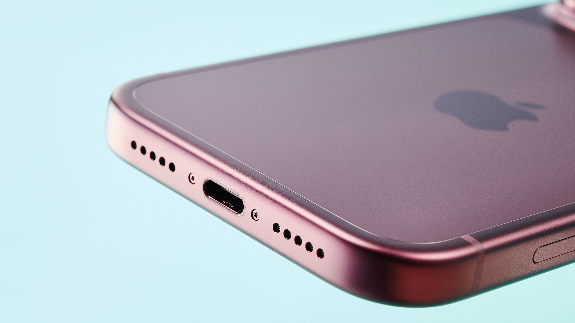 Apple iPhone 18 Pro in burgundy on green background