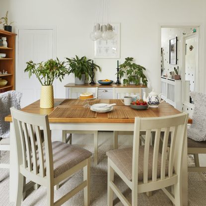 Monochrome dining room with hand painted dot walls
