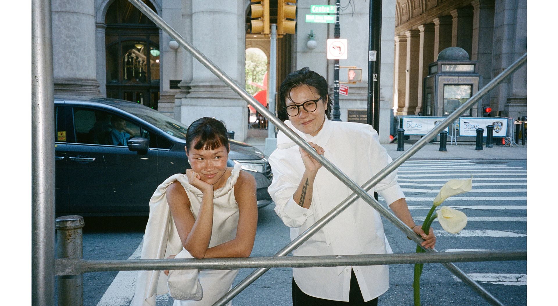Trisha and Gui in NYC wearing city hall ceremony outfits.