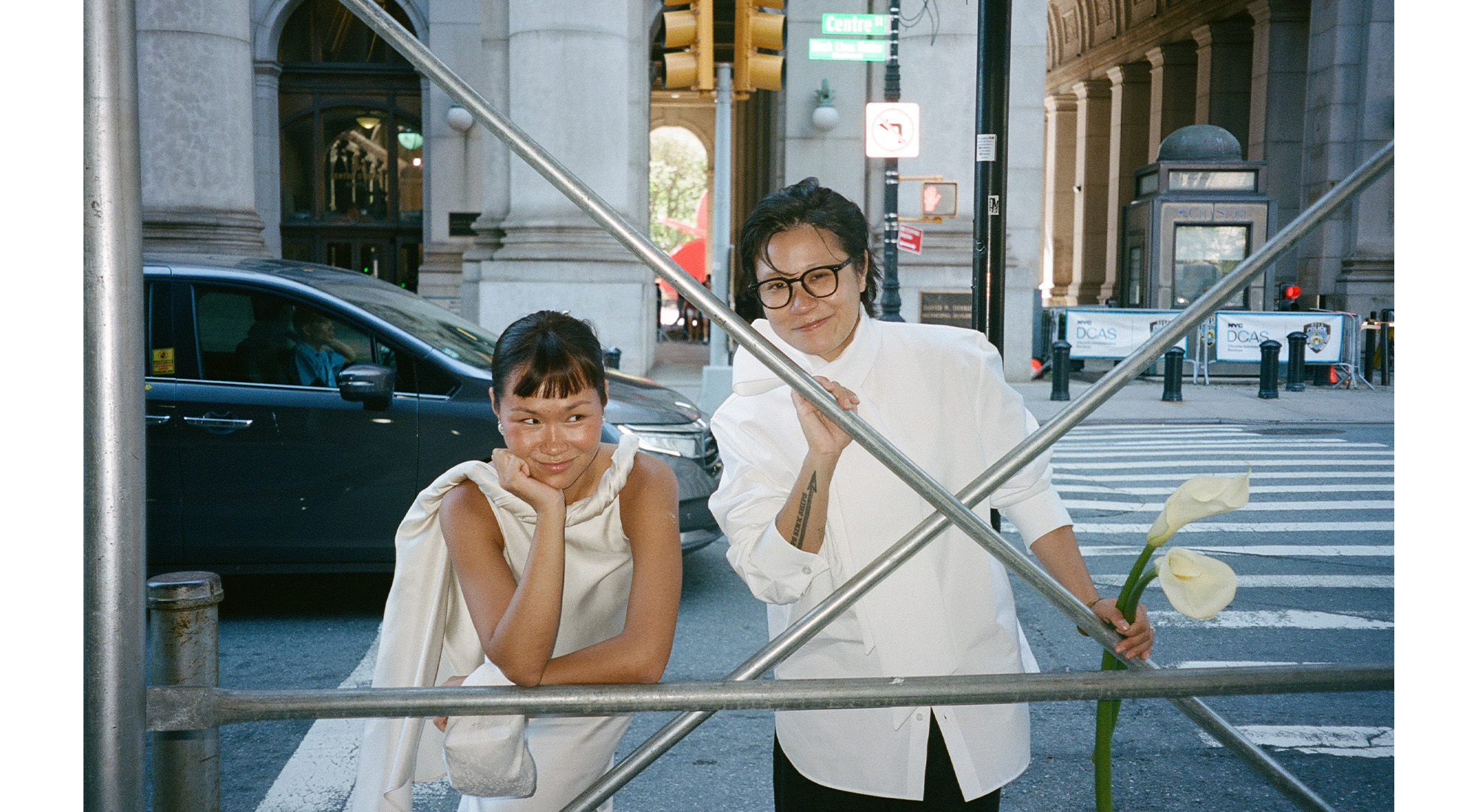 Trisha and Gui in NYC wearing city hall ceremony outfits.