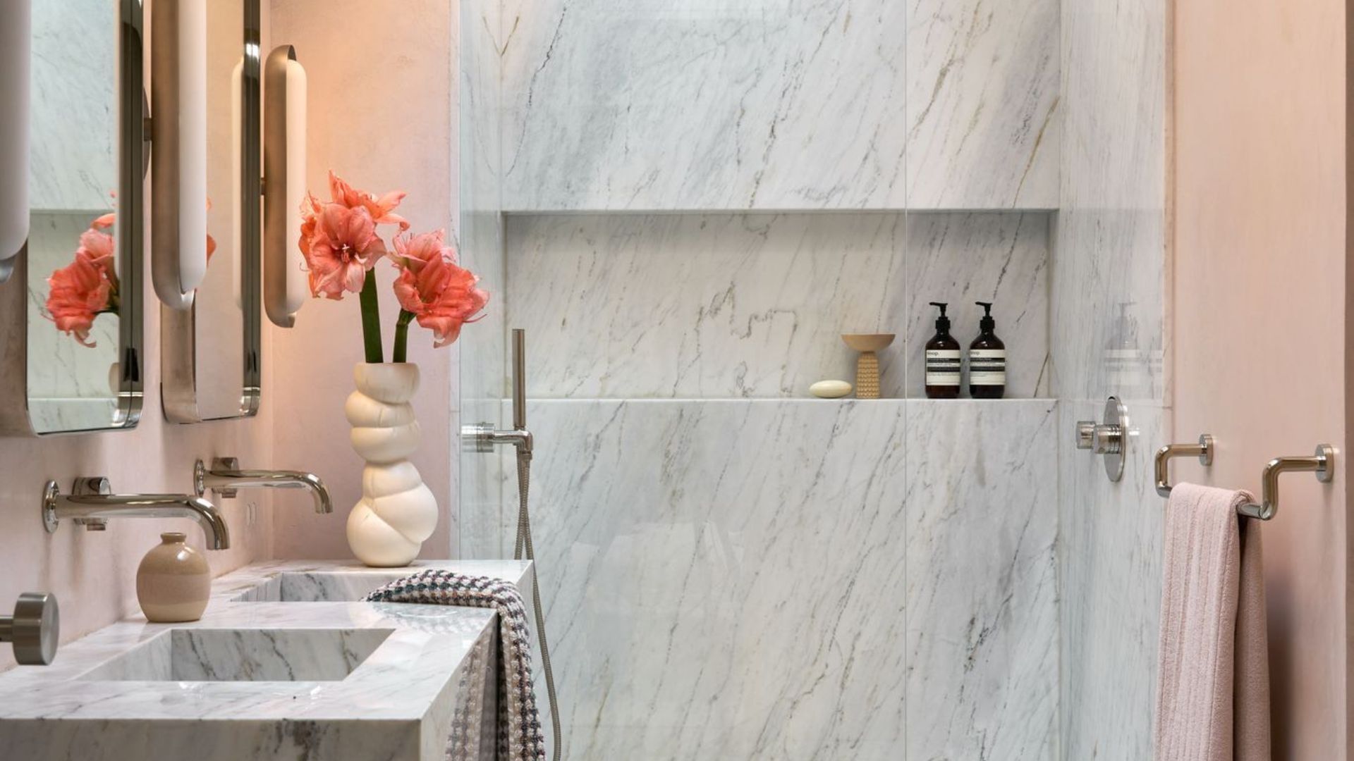 A bathroom painted in soft pink tones to illustrate paint color ideas for bathrooms