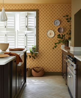 mustard yellow wallpaper in a kitchen by little greene