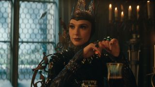 The Evil Queen (Gal Gadot) has dinner in Snow White