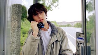 Brendan (Joseph Gordon-Levitt) in a payphone booth in a scene from Rian Johnson's 2005 movie, "Brick".