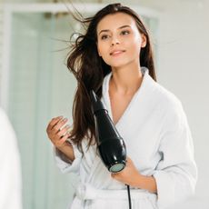 woman blow dryer hair
