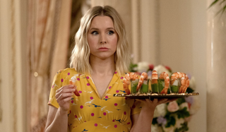 the good place eleanor eating a plate of shrimp