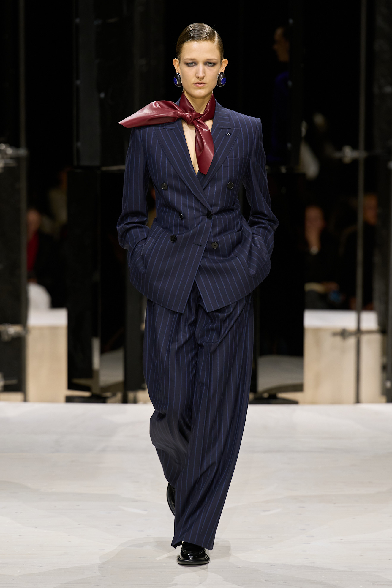 a model wears a tailored look at the givenchy f/w 26 show.
