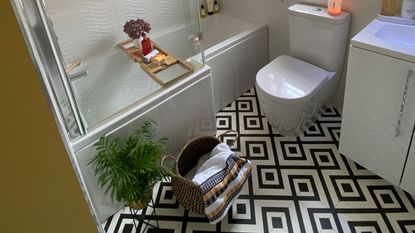 bathroom with black and white tiles