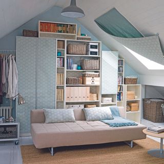 attic room with sofa bed and wardrobe