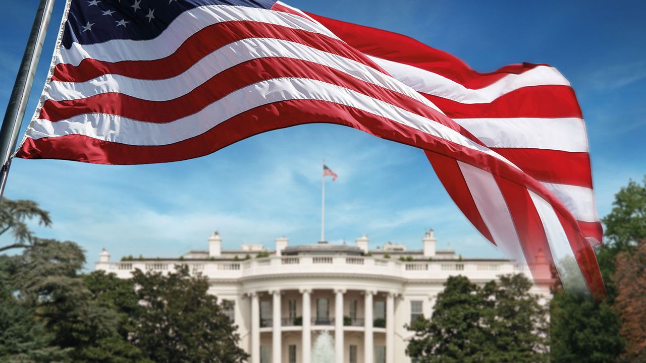 US flag in front of the White House