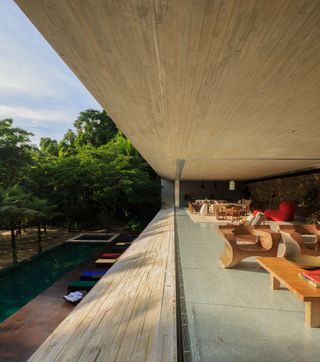 casa paraty, seen here from living room and open glazing towards terrace and pool below